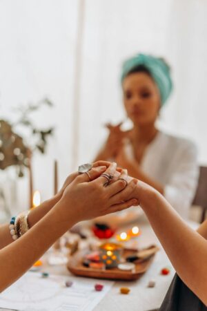 A serene indoor Reiki healing session with focus on hands, crystals, and a calming atmosphere.